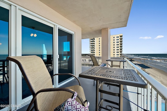 balcony featuring a water view