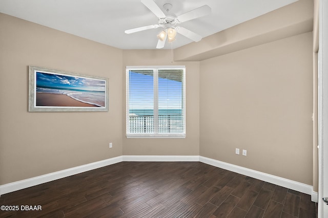 spare room featuring ceiling fan and dark hardwood / wood-style floors