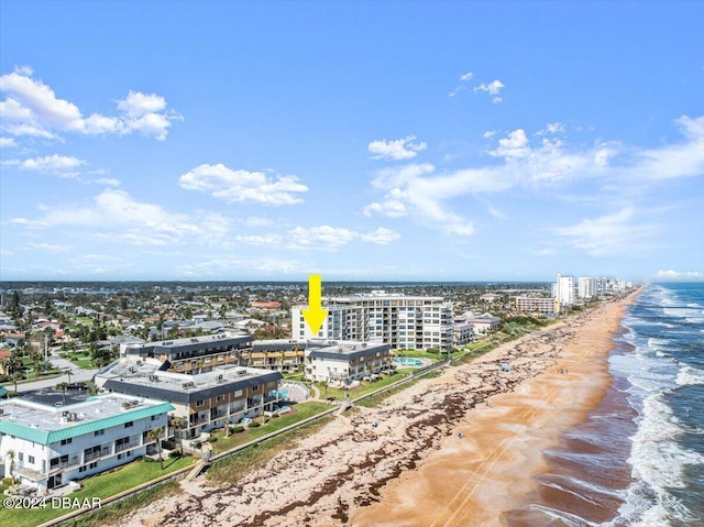 bird's eye view with a beach view and a water view