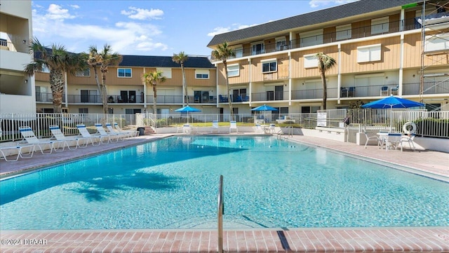 view of swimming pool featuring a patio area