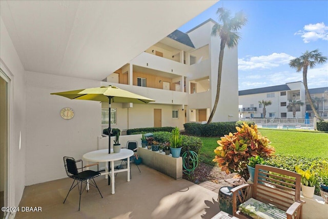 view of patio with a balcony