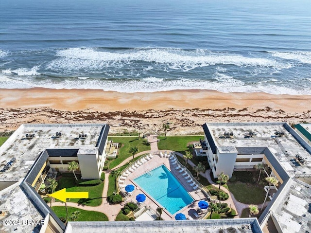 bird's eye view with a water view and a view of the beach