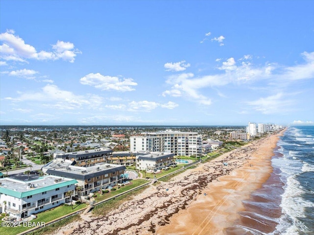 bird's eye view featuring a view of the beach and a water view