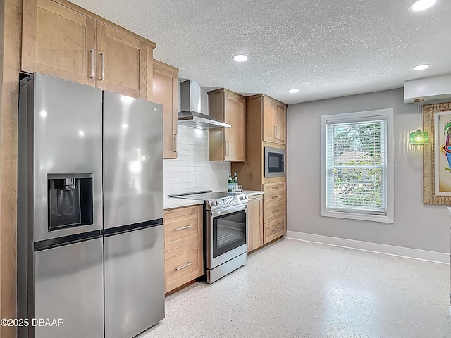kitchen featuring appliances with stainless steel finishes, wall chimney exhaust hood, baseboards, a textured ceiling, and recessed lighting