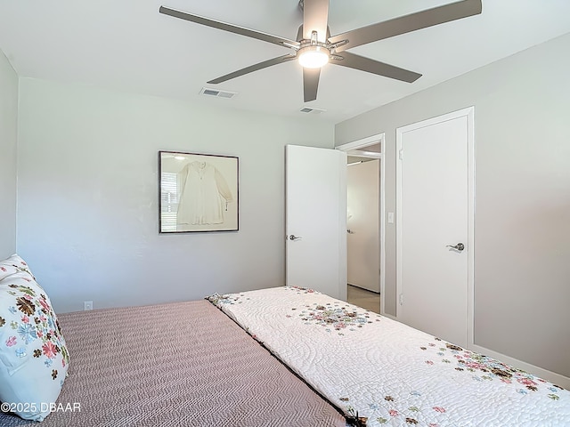 bedroom with a ceiling fan and carpet floors