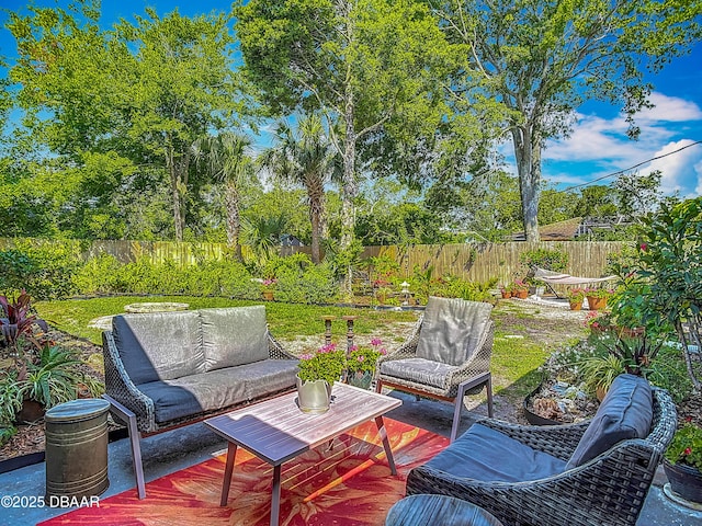view of patio / terrace featuring an outdoor hangout area and a fenced backyard