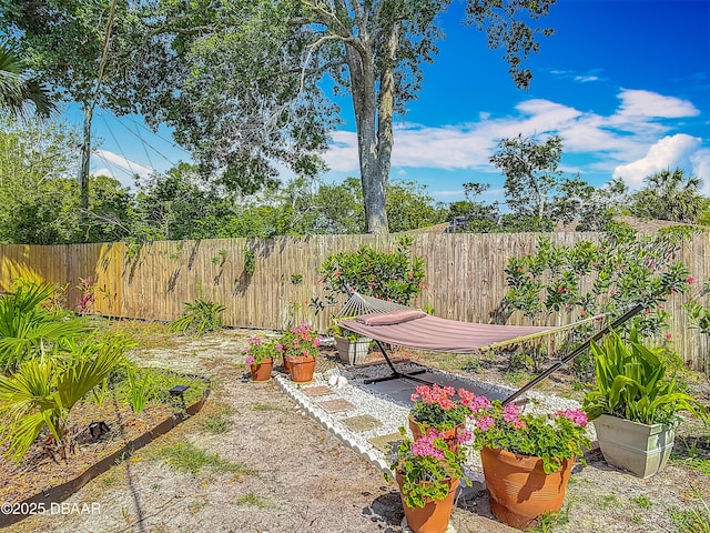 fenced backyard featuring a patio