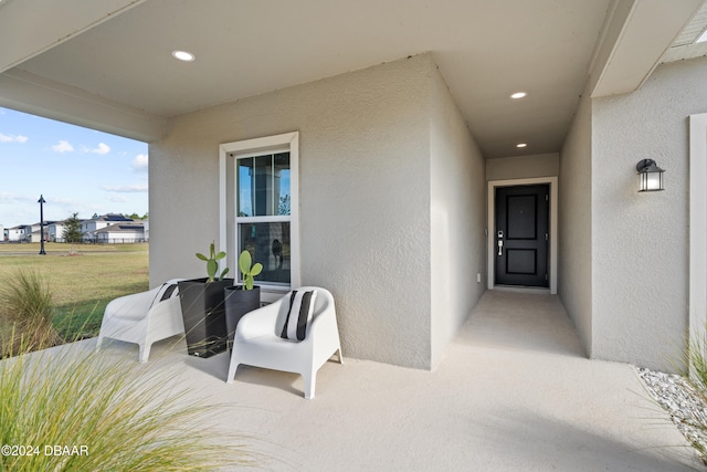 property entrance featuring a patio