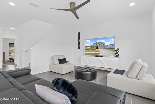 tiled living room featuring ceiling fan