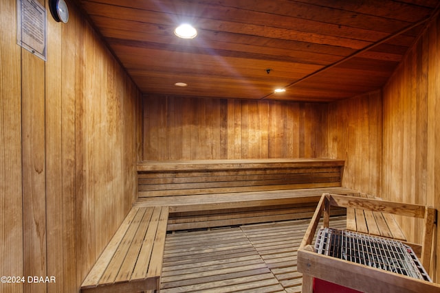 view of sauna / steam room with wooden walls and wood ceiling