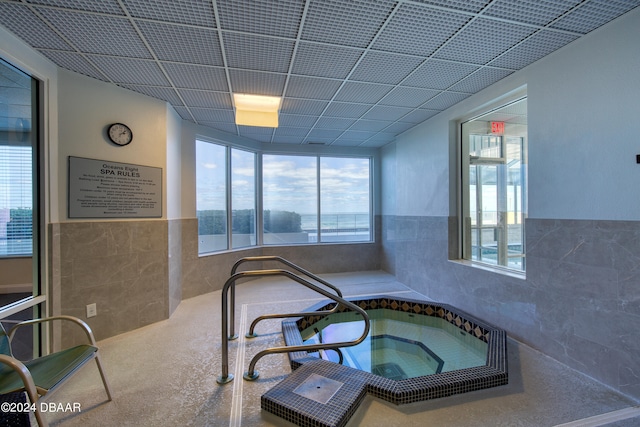 view of swimming pool featuring an indoor in ground hot tub