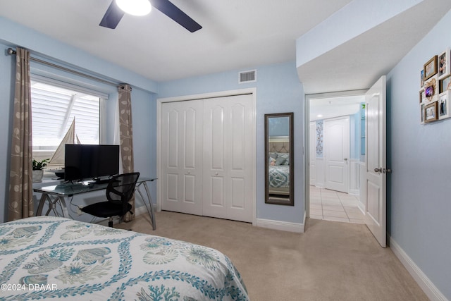 2937 S Atlantic Ave Unit 1504, Daytona Beach Shores, FL 32118 - carpeted bedroom featuring a closet, baseboards, and ceiling fan