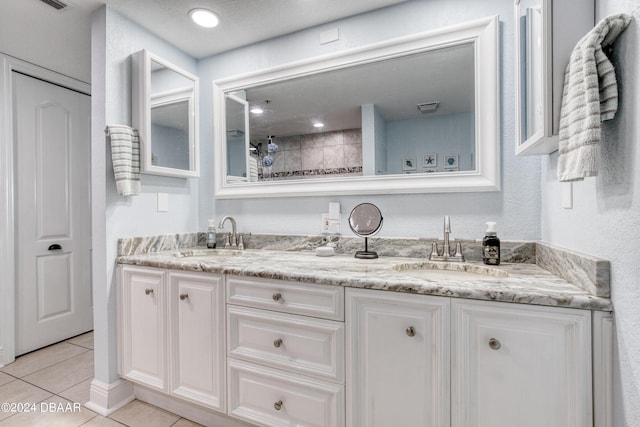 2937 S Atlantic Ave Unit 1504, Daytona Beach Shores, FL 32118 - bathroom featuring double vanity, tile patterned flooring, and tiled shower