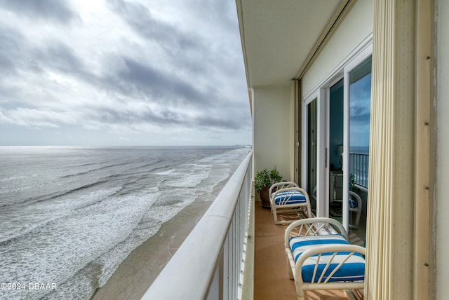 balcony featuring a water view