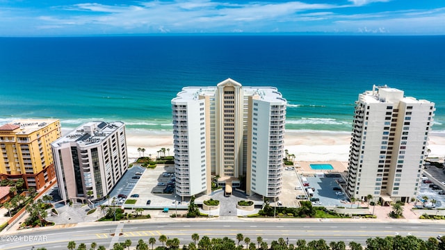 aerial view featuring a water view and a view of the beach