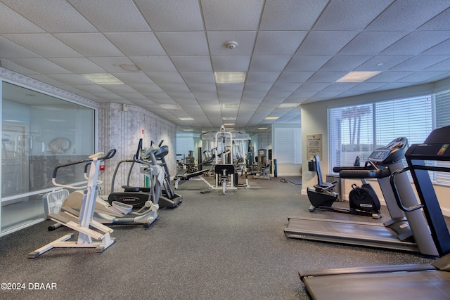 workout area with a drop ceiling