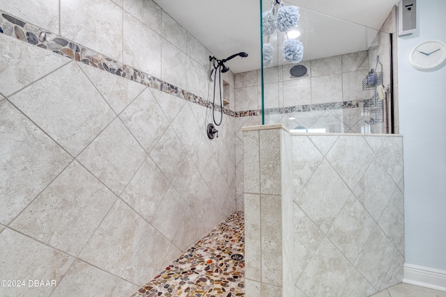 bathroom with tiled shower