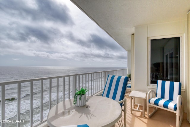 2937 S Atlantic Ave Unit 1504, Daytona Beach Shores, FL 32118 - balcony with a water view and outdoor dining area