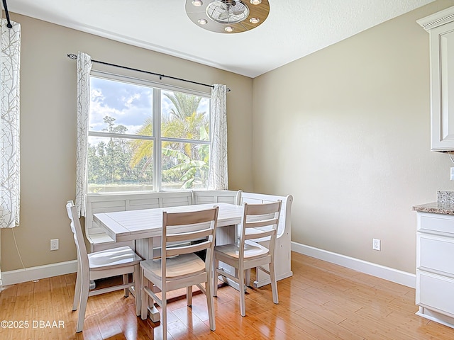 417 Grande Sunningdale Loop, Daytona Beach, FL 32124 - dining area featuring baseboards and light wood-style flooring