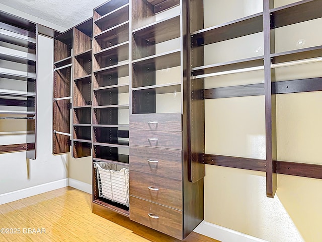 417 Grande Sunningdale Loop, Daytona Beach, FL 32124 - spacious closet featuring wood finished floors