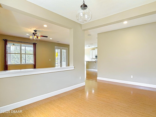 417 Grande Sunningdale Loop, Daytona Beach, FL 32124 - empty room featuring light wood-style flooring, baseboards, ceiling fan, and recessed lighting