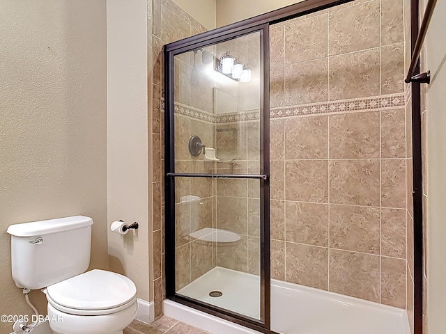 417 Grande Sunningdale Loop, Daytona Beach, FL 32124 - bathroom with toilet, a stall shower, and tile patterned flooring