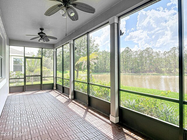 417 Grande Sunningdale Loop, Daytona Beach, FL 32124 - unfurnished sunroom with ceiling fan, a water view, and view of scattered trees