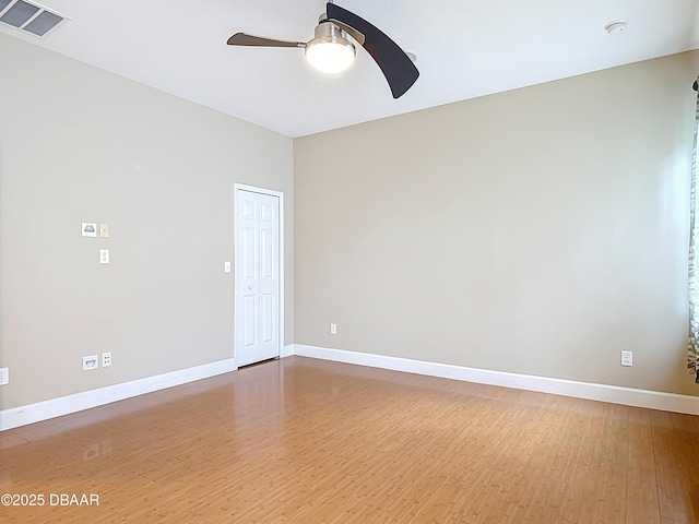 417 Grande Sunningdale Loop, Daytona Beach, FL 32124 - empty room featuring ceiling fan, wood finished floors, and baseboards