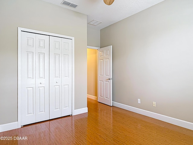 417 Grande Sunningdale Loop, Daytona Beach, FL 32124 - unfurnished bedroom featuring light wood-style floors, baseboards, and a closet