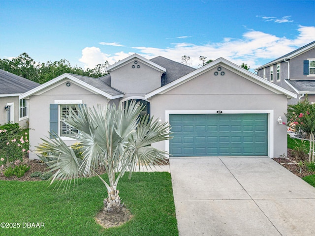 417 Grande Sunningdale Loop, Daytona Beach, FL 32124 - view of front facade with an attached garage, stucco siding, driveway, and a front lawn