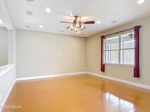 417 Grande Sunningdale Loop, Daytona Beach, FL 32124 - unfurnished room featuring light wood-type flooring, baseboards, recessed lighting, and ceiling fan