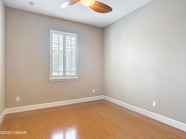 417 Grande Sunningdale Loop, Daytona Beach, FL 32124 - unfurnished room featuring a ceiling fan, a smoke detector, baseboards, and wood finished floors