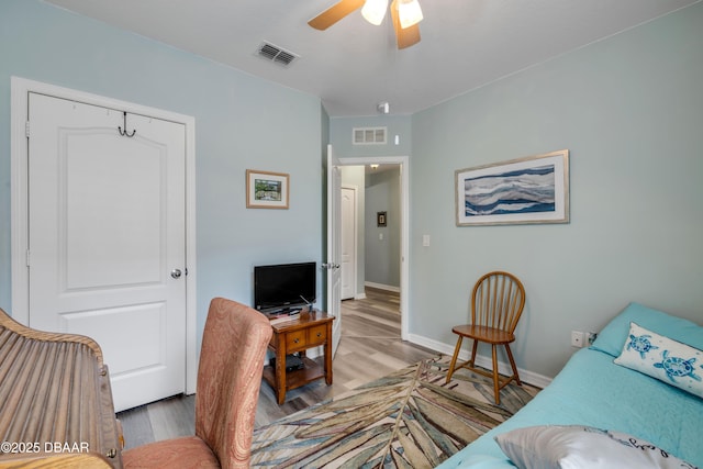 448 White Coral Ln, New Smyrna Beach, FL 32168 - living room featuring light wood-style floors and a ceiling fan