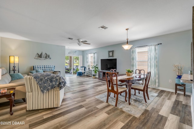 448 White Coral Ln, New Smyrna Beach, FL 32168 - dining space featuring light wood-style flooring and a ceiling fan