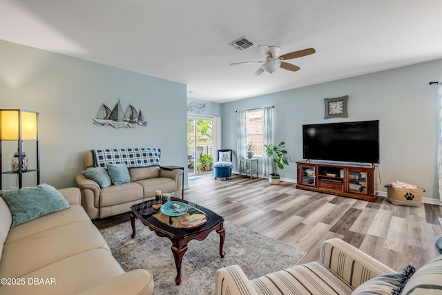448 White Coral Ln, New Smyrna Beach, FL 32168 - living area featuring a ceiling fan and wood finished floors