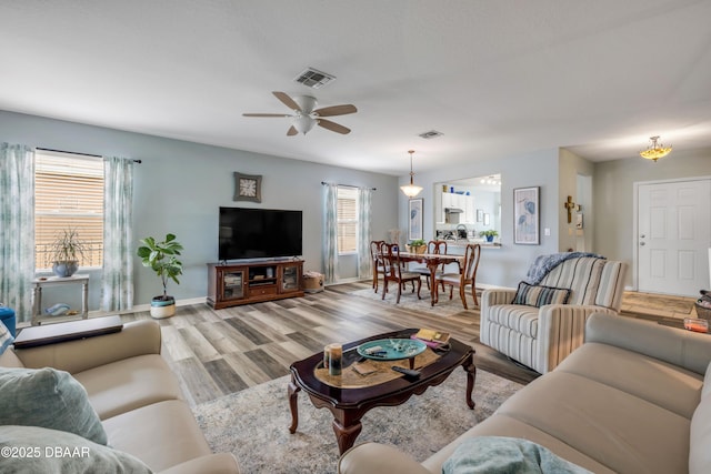 448 White Coral Ln, New Smyrna Beach, FL 32168 - living room featuring wood finished floors and a ceiling fan