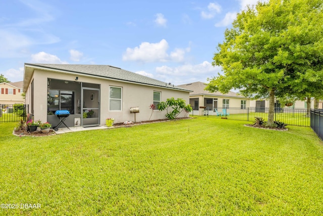 448 White Coral Ln, New Smyrna Beach, FL 32168 - rear view of property with stucco siding, a sunroom, and a fenced backyard