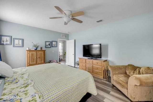 448 White Coral Ln, New Smyrna Beach, FL 32168 - bedroom featuring light wood-type flooring and a ceiling fan