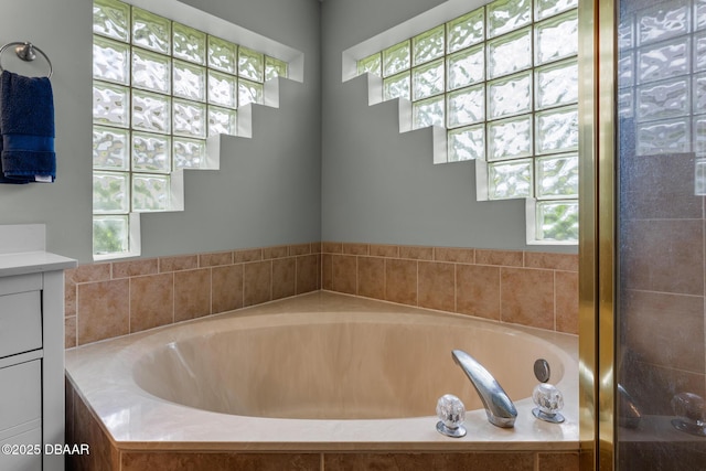 bathroom featuring plenty of natural light and vanity