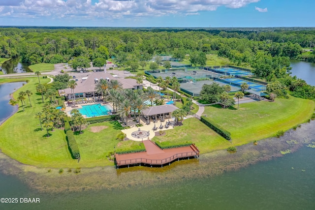 aerial view with a water view and a forest view