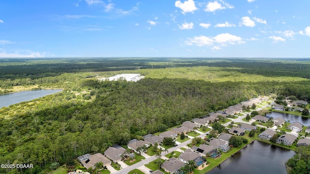 aerial view featuring a residential view, a water view, and a wooded view