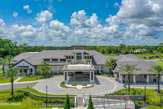 exterior space featuring fence and curved driveway