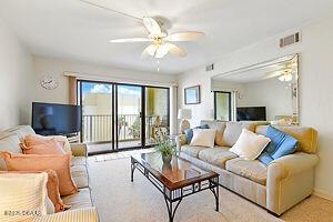 4175 S Atlantic Ave Unit 405, New Smyrna Beach, FL 32169 - living area featuring ceiling fan