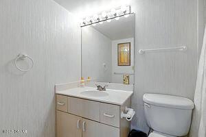 4175 S Atlantic Ave Unit 405, New Smyrna Beach, FL 32169 - bathroom featuring vanity and toilet