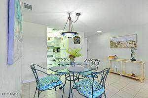 4175 S Atlantic Ave Unit 405, New Smyrna Beach, FL 32169 - tiled dining area with baseboards