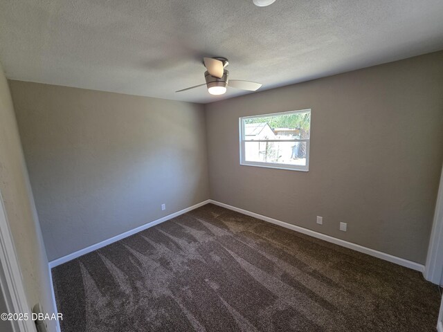 1909 Nelson Ave, Ormond Beach, FL 32174 - empty room featuring dark carpet, a textured ceiling, baseboards, and ceiling fan