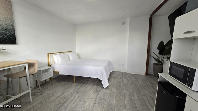 bedroom featuring hardwood / wood-style floors