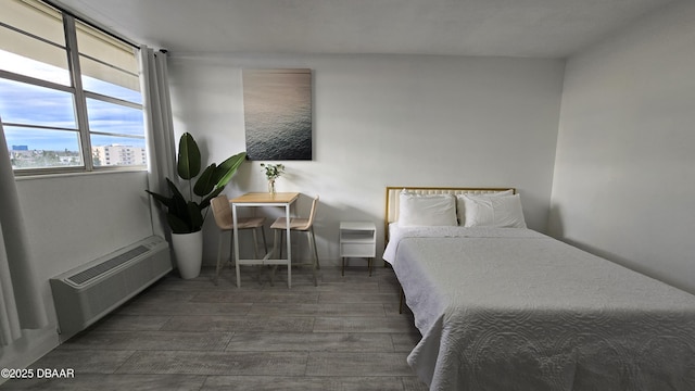 bedroom featuring dark wood-type flooring