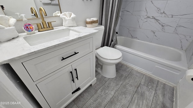 full bathroom featuring toilet, vanity, and shower / bathtub combination with curtain