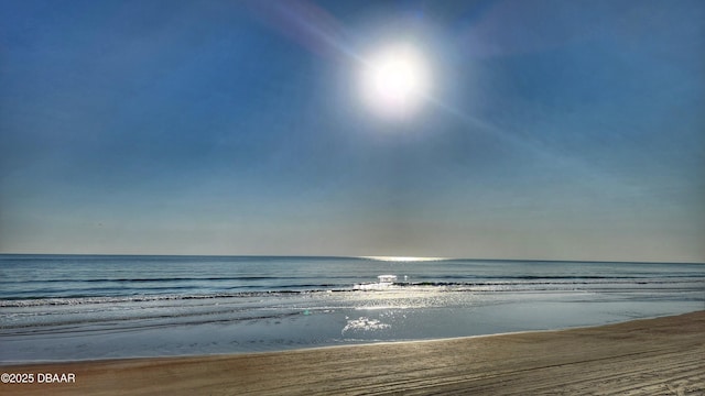 view of water feature with a beach view